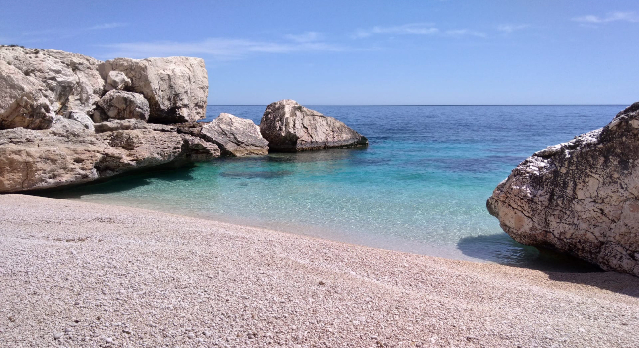 Limestone-backed Mediterranean cove along the Gulf of Orosei and Baunei coast in Sardinia