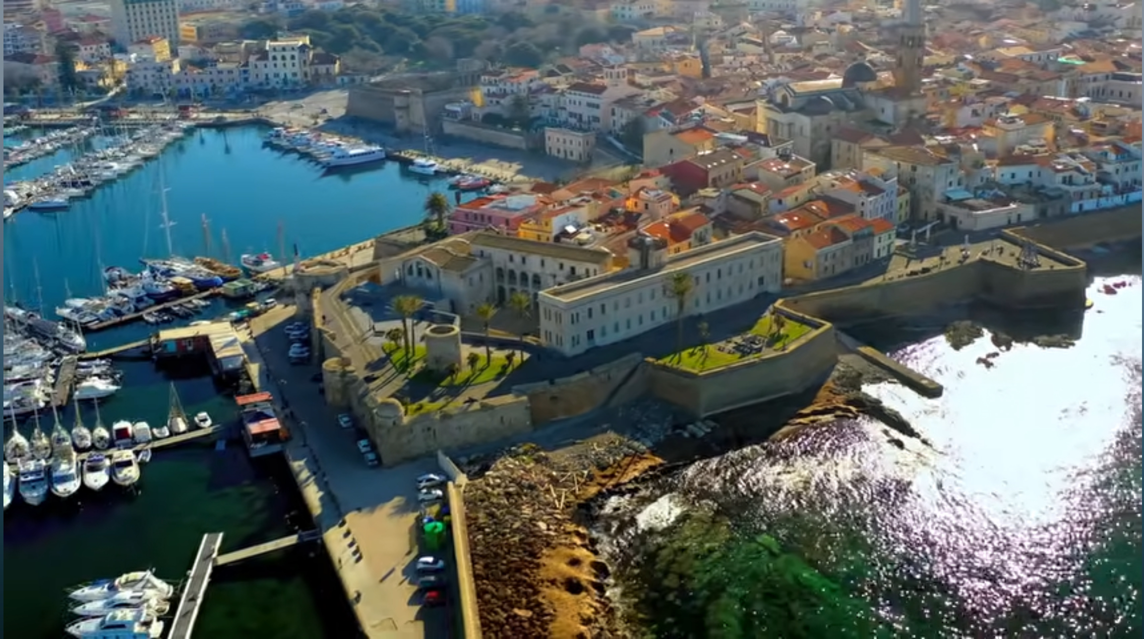 Aerial view of Alghero's historic center, fortified waterfront and harbor
