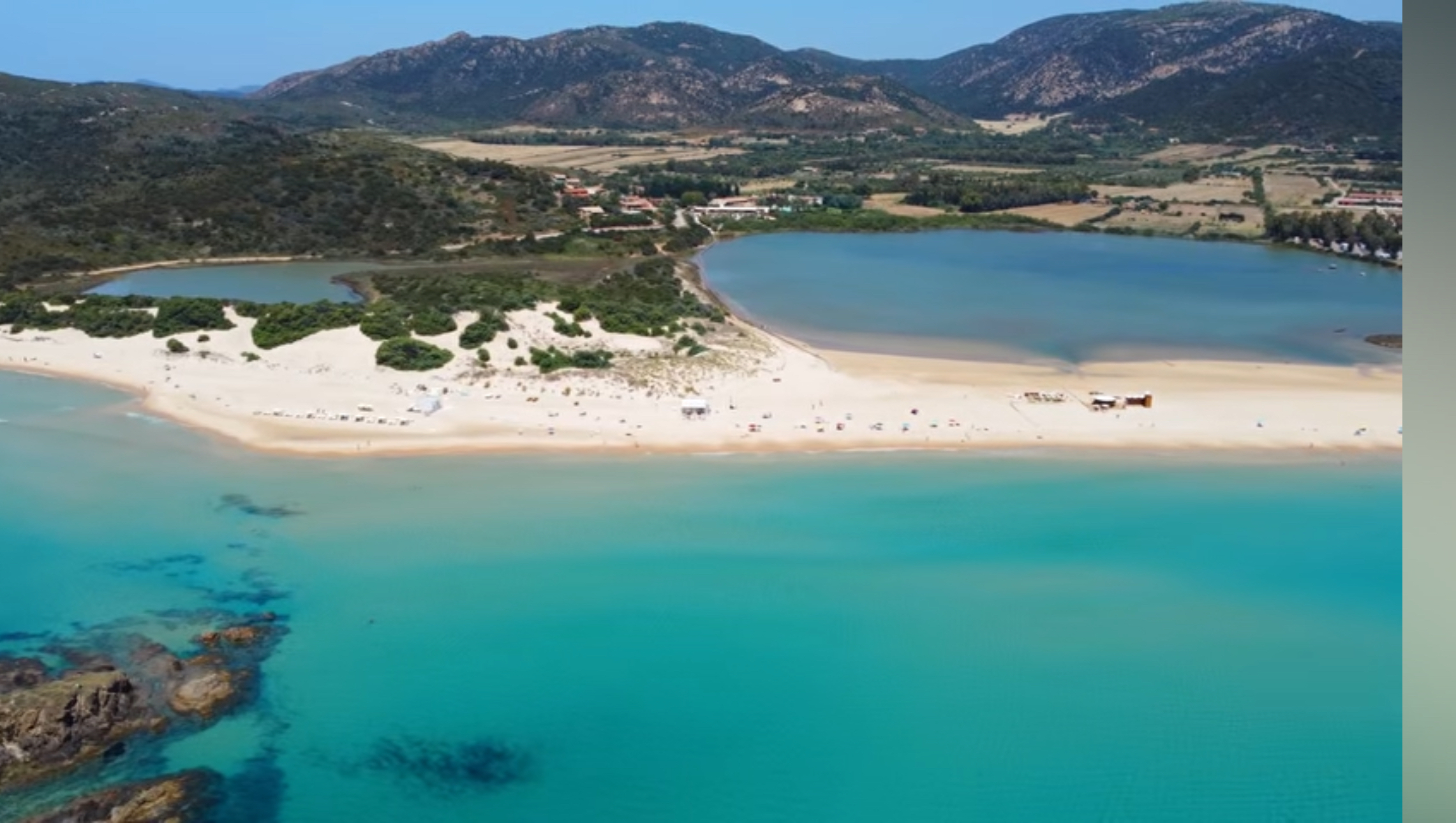 Stagno di Chia lagoon behind the sandy beach and dunes
