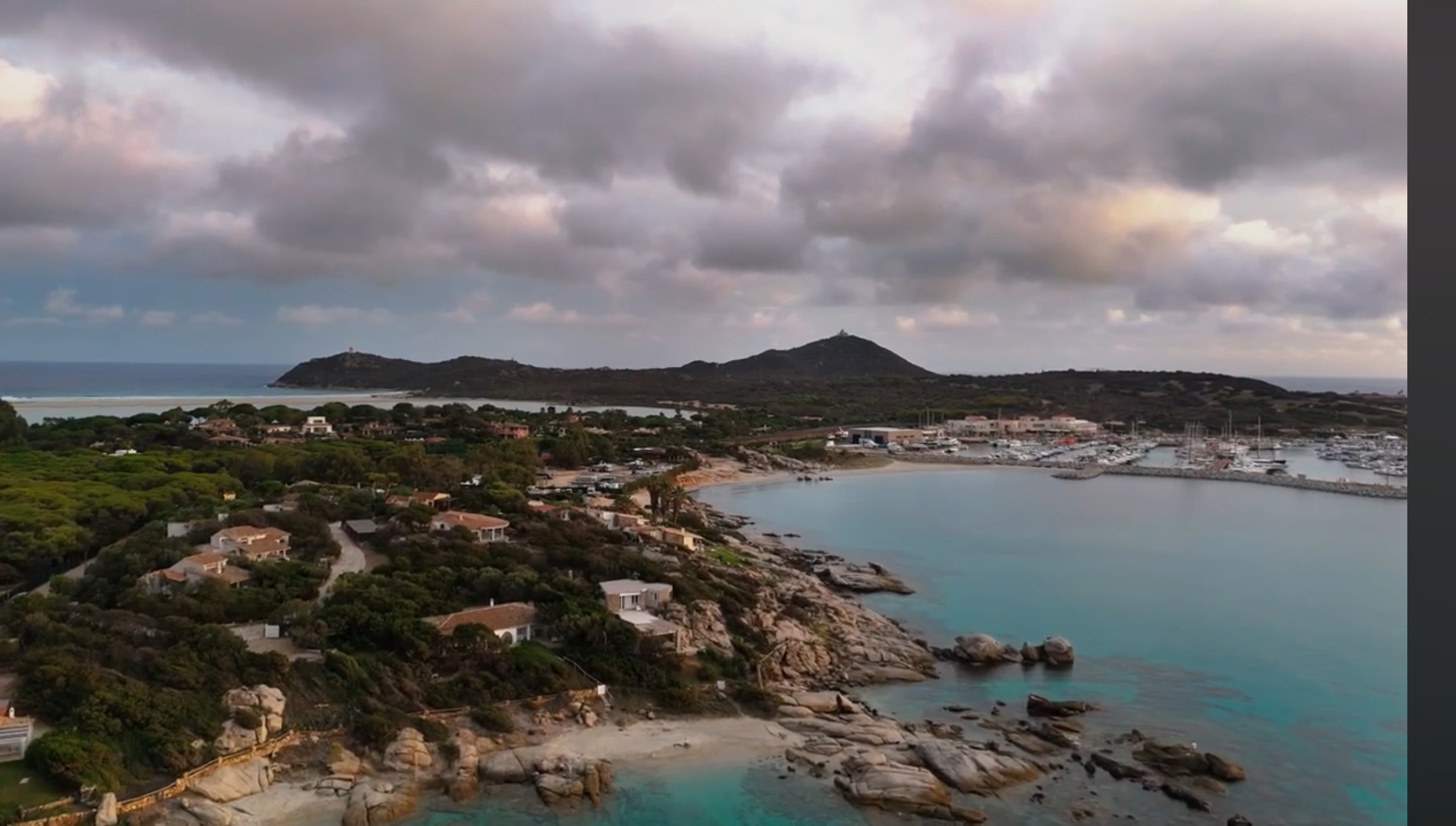 Wide view of the coastline and clear water near Villasimius in southern Sardinia