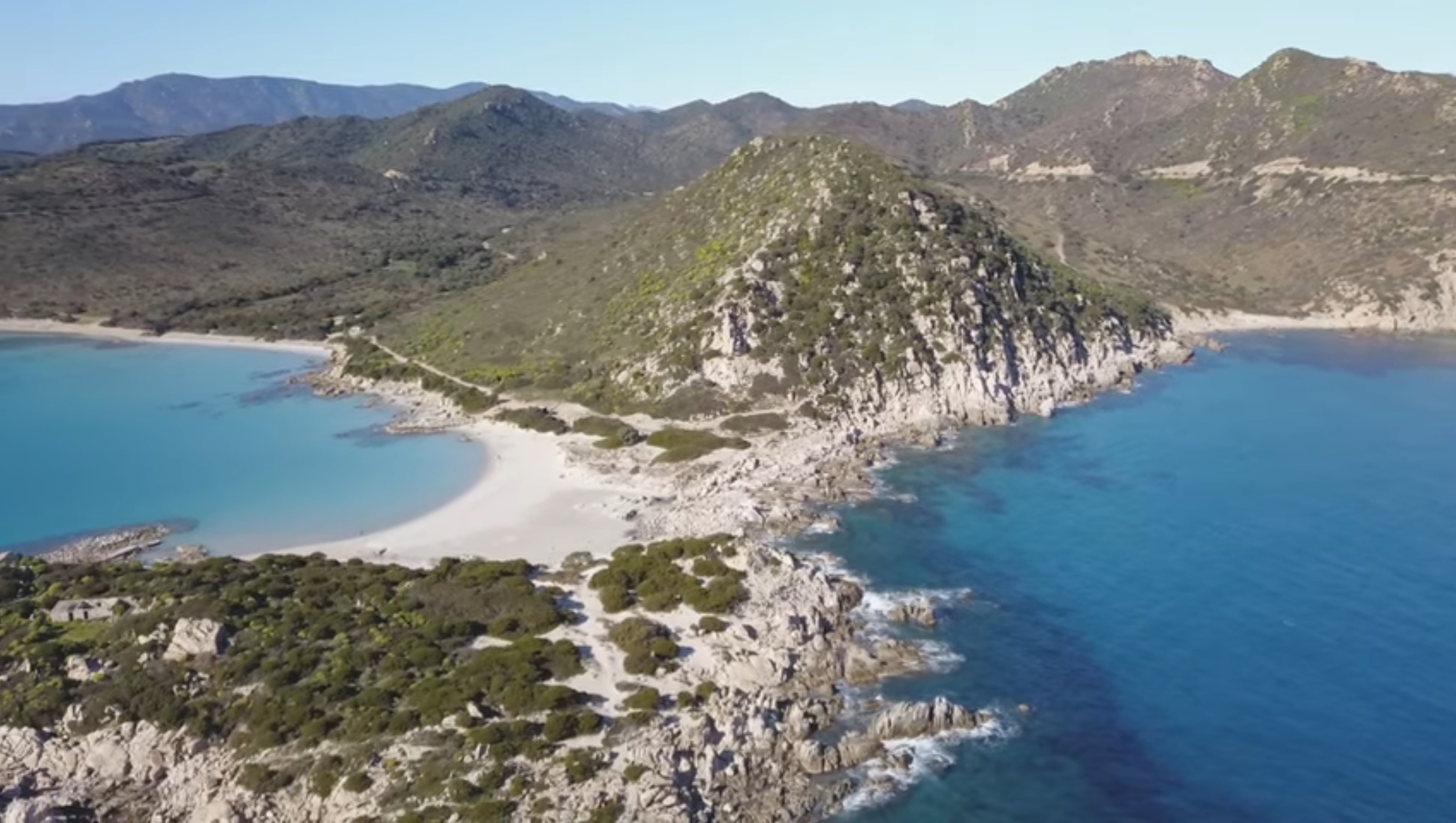 Granite rocks and clear coastal water near Punta Molentis in Villasimius