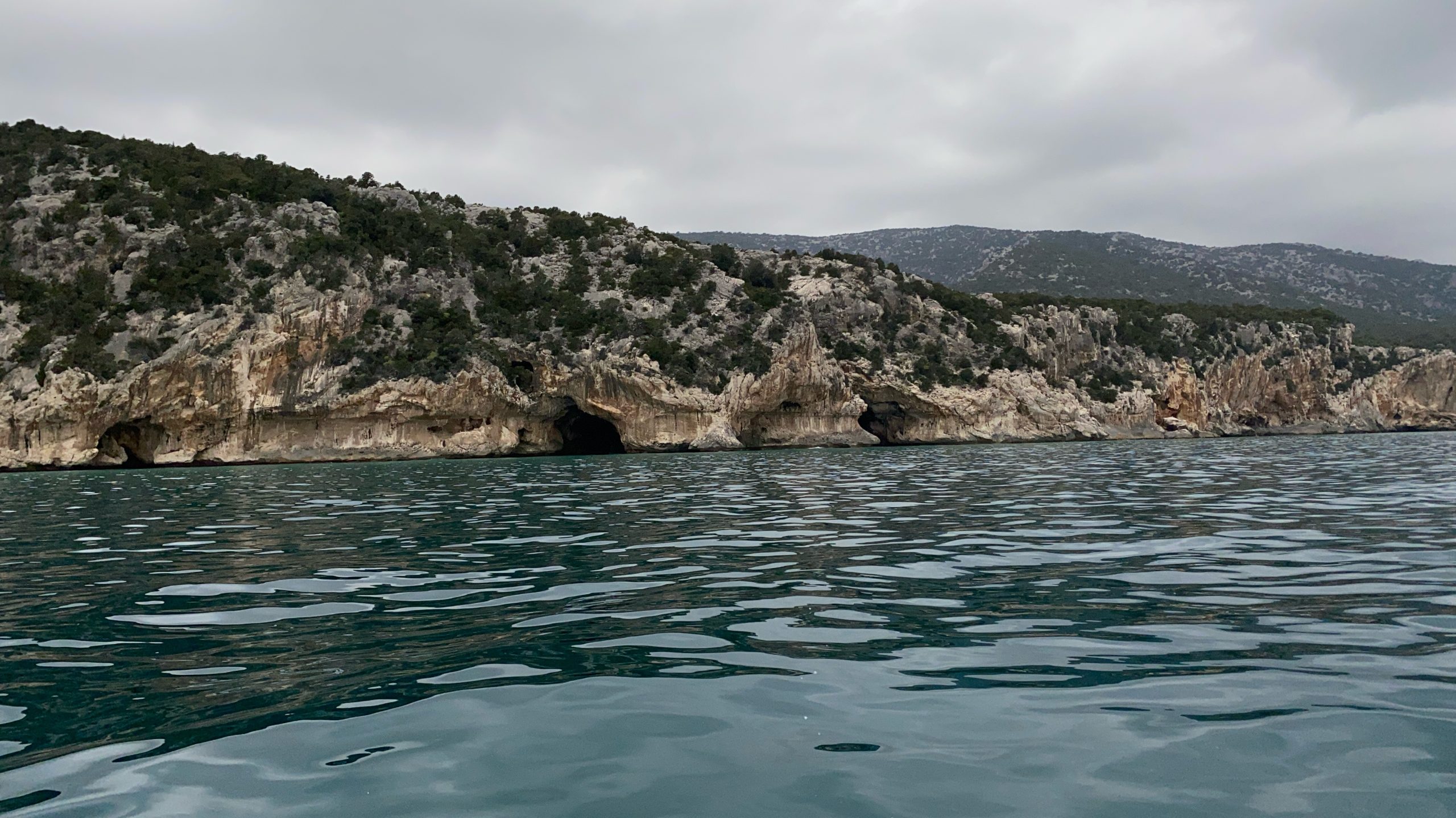 Gulf of Orosei limestone coastline viewed from a gommone returning from Cala Luna